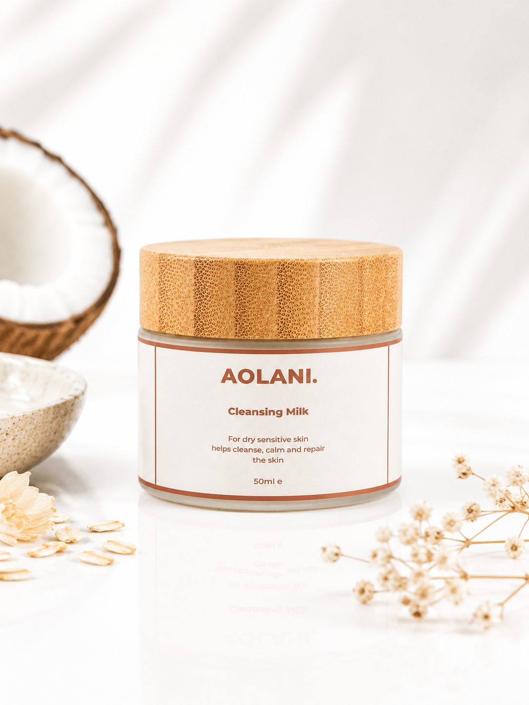 Aolani Cleansing Milk for dry sensitive skin with natural ingredients styled around the frosted glass jar