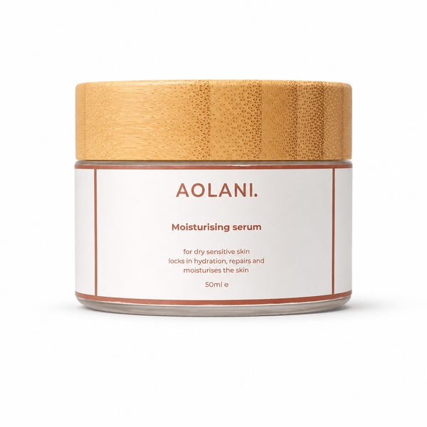 Aolani Moisturising Serum for dry sensitive skin in a frosted glass jar with bamboo lid on a white background